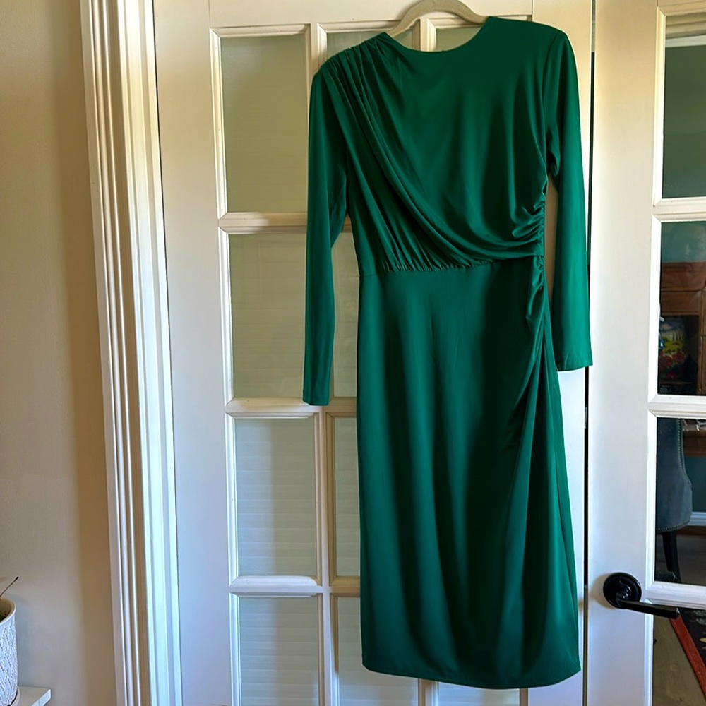 Dark green gorgeous dress. Size small. Never worn. New but removed tags.